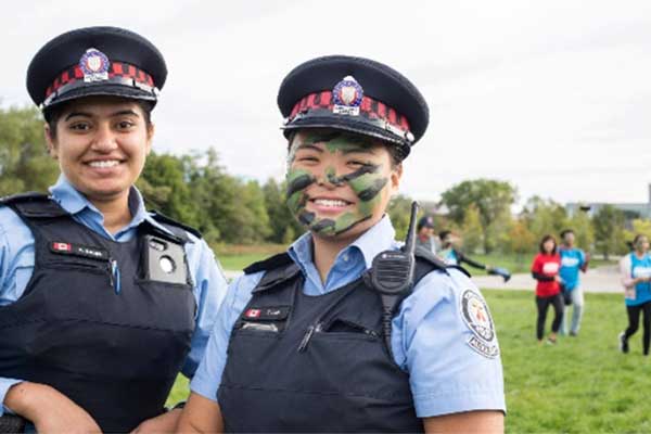 Two students in police uniform