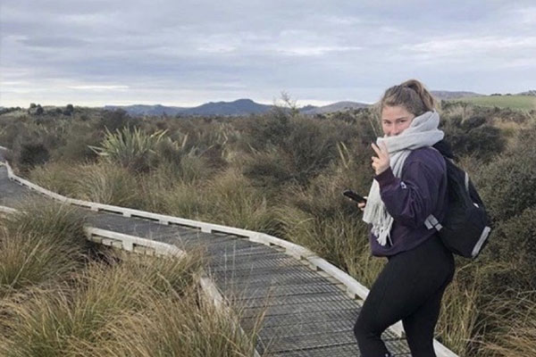 Alanah Vellone on a boardwalk in New Zealand