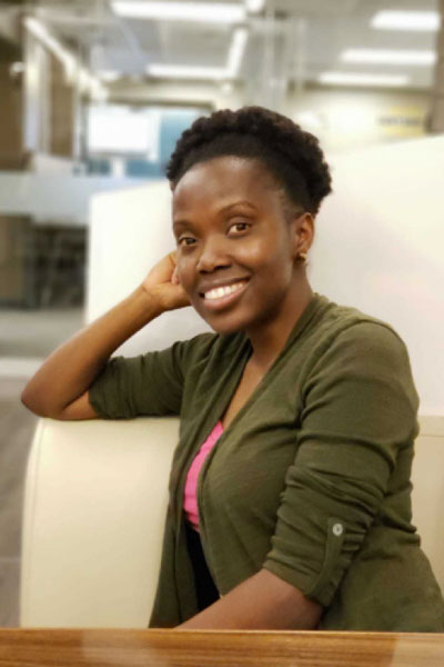 Michelle Tembo sitting at a table