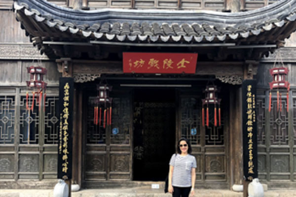 Vriti Bajaj standing in front of a temple
