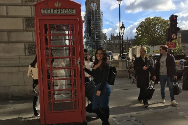 Maria Camila Ruiz Tacha with a red telephone box with Big Ben in the background