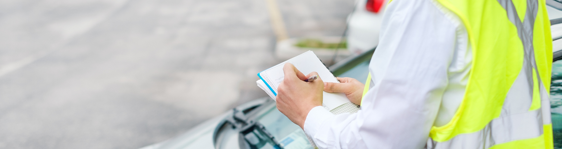 parking officer writing a ticket