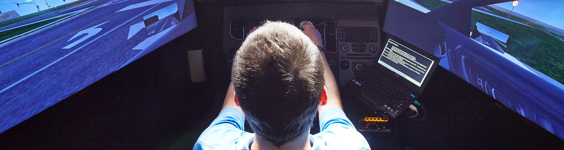 student inside vehicle simulation