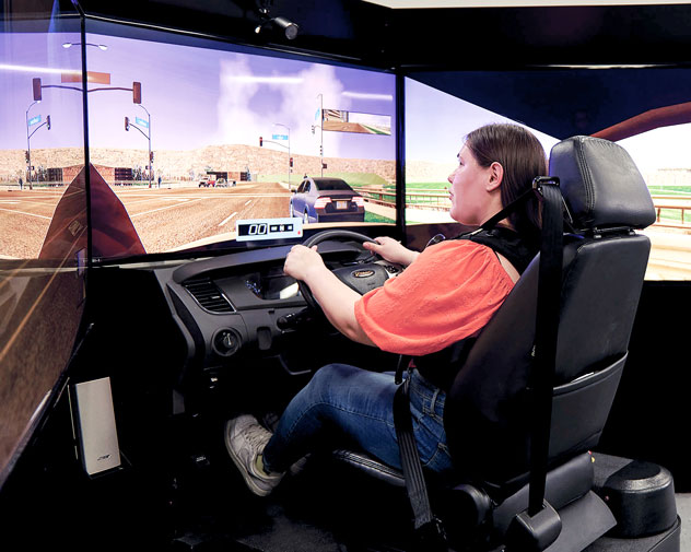 student using the driving simulator