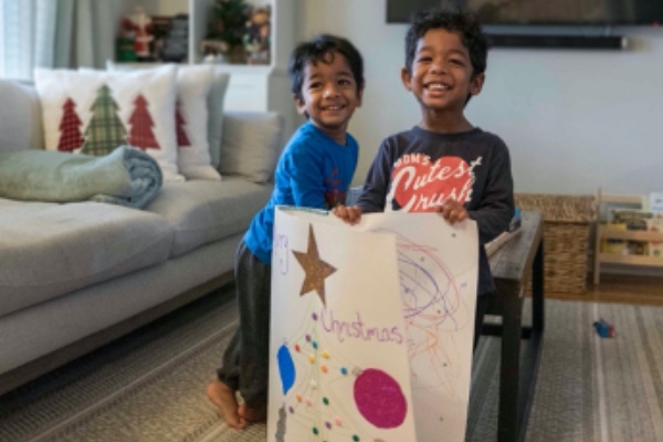 Kavelle Maharaj’s twins showing off their homemade holiday card