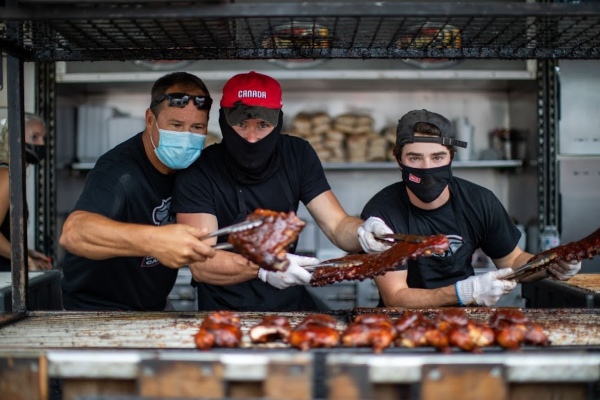 Food workers making ribs