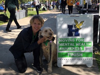 Joanne Spence, Program Coordinator for the ADMH programMove for Mental Health Awareness Walk with dog