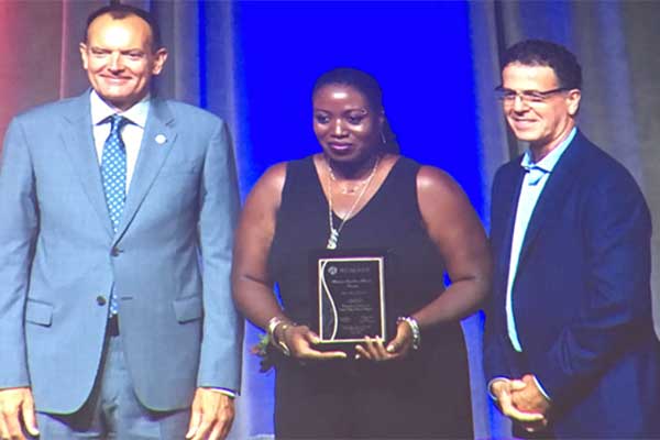 Rai Reece with Chris Whitaker receiving an award