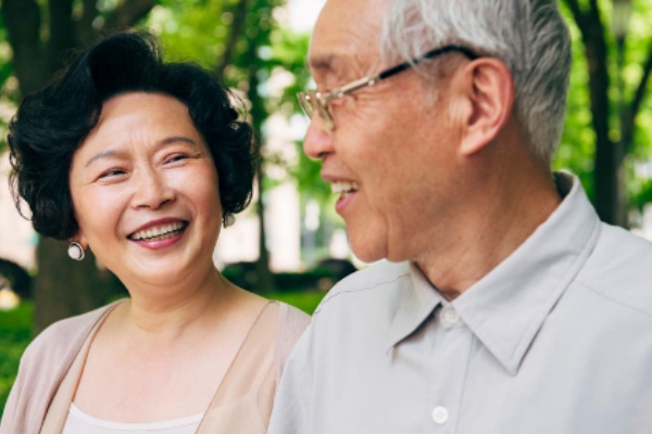 Two elderly people smiling
