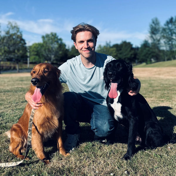 Cole Palashniuk with two dogs