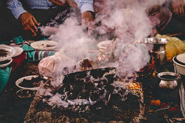 Image of a person cooking with smoke