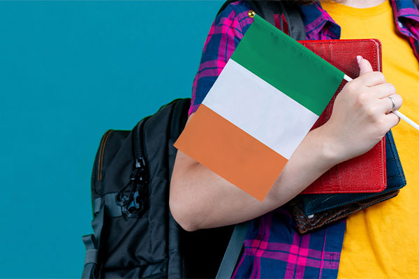 Person holding the flag of Ireland