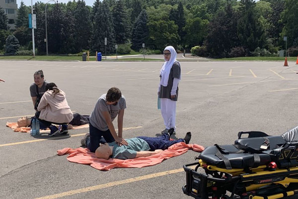 People practicing CPR on a dummy