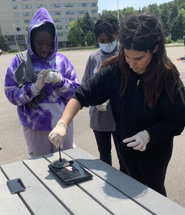 People practicing taking fingerprints