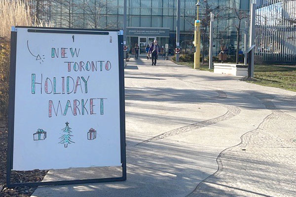 Sign outside advertising the New Toronto Holiday Market