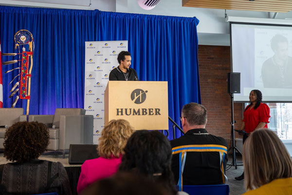 Person standing behind podium