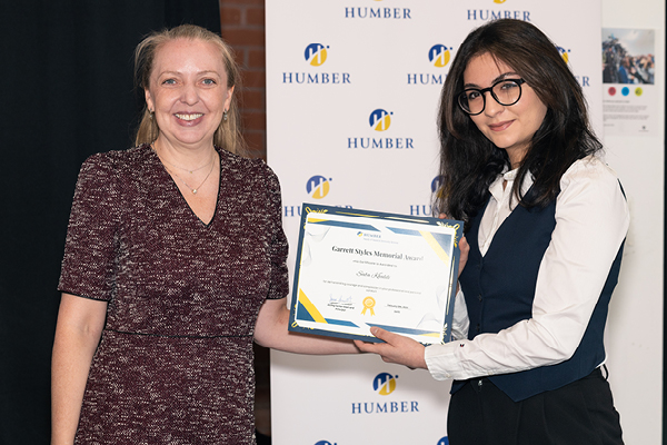 2 females holder Awards Ceremony Certificate