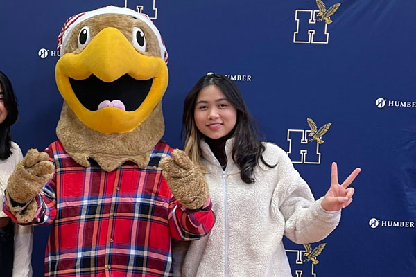 Exchange student with Humber mascot