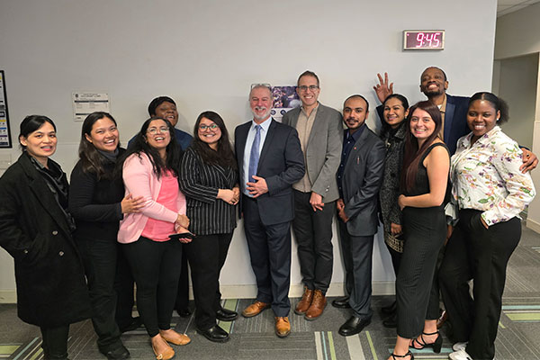group of people standing smiling