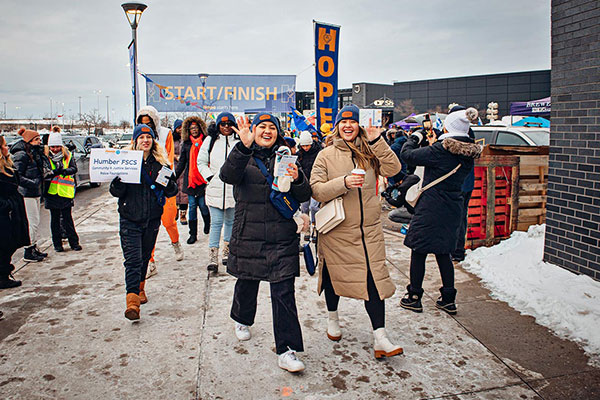 group of people walking outside in the cold
