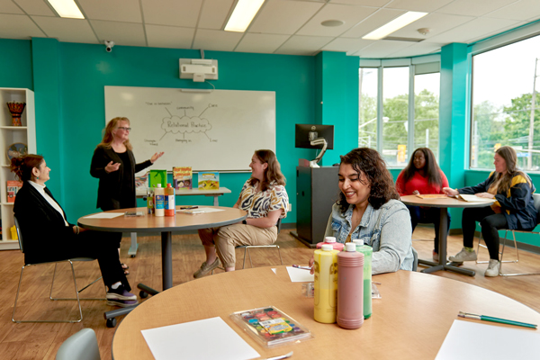 Students learning in children's play room