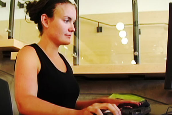 female typing on a computer