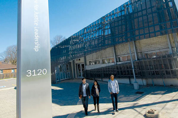 people standing in front of Centre for Justice building