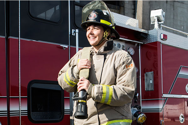 firefighter holding fire hose